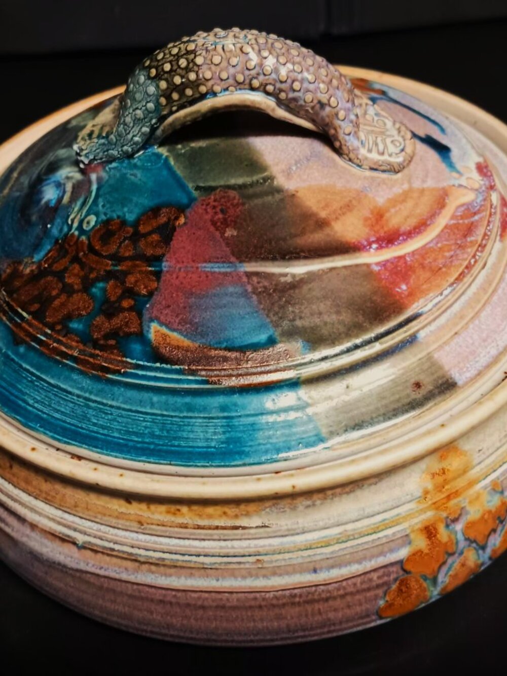 Signed studio pottery casserole dish. Beautiful vivid colors w/ textured handles